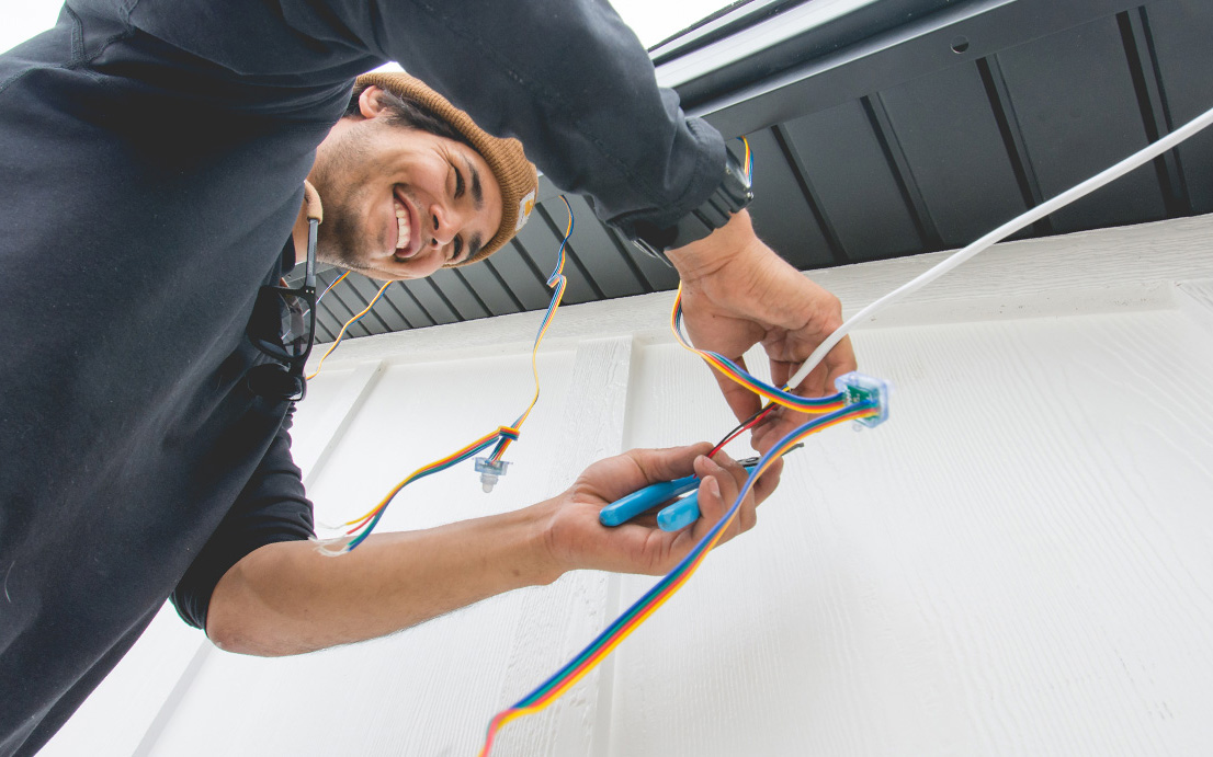 Professional installation of permanent exterior trim lighting