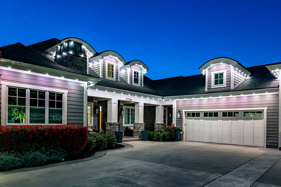 Home exterior lit with warm white security lighting